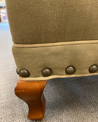 ARHAUS UPHOLSTERED OTTOMAN W/GREEN FABRIC AND NAIL HEAD DETAIL