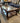 DK WOOD, RECTANGLE GLASS TOP, BOTTOM SHELF, METAL DECORATIVE SIDES