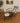 BLACK WROUGHT IRON BISTRO SET, GRAY UPHOLSTERY, GLASS TOP