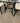 DINING SET OVAL GLASS TABLE AND BLACK METAL LEGS WITH 6 CHAIRS