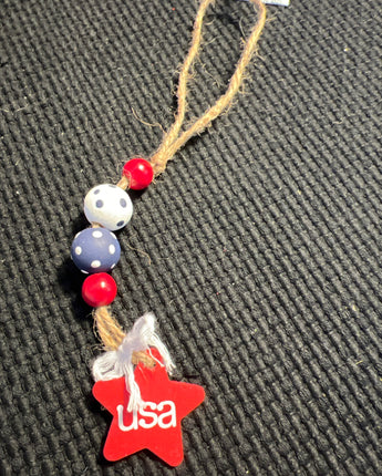 WOOD BEADS STRUNG ON JUTE RED WHITE AND BLUE