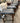 SET OF 4, BLACK FAUX LEATHER SEATS, NAIL HEAD TRIM, WOODEN LEGS