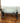 ARHAUS, INDUSTRIAL CRANK DESK w/ GLASS TOP and IRON BASE