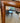 MEDIUM BROWN WOOD FRAMED MIRROR W/BEVELED EDGES