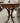 DUNCAN PHYFE ANTIQUE WOOD SIDE TABLE WITH LEATHER INLAY AND BRONZE CLAW FEET