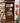 WOOD BOOKCASE w/ 3 SHELVES w/ GLASS INSERT, 1 DRAWER, 2 DOORS