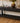 BLACK DISTRESSED SOFA TABLE, 4 DRAWERS, BOTTOM SHELF