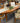 HARDEN CHERRY OVAL DINING TABLE AND 6 CRISSCROSSED BACK CHAIRS, 16" LEAF