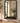BLACK METAL FRAMED MIRROR WITH SMALL BOTTOM TRAY SHELF