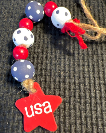 WOOD BEADS STRUNG ON JUTE RED WHITE AND BLUE
