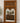LARGE WOOD FRAMED MIRROR WITH HAND CARVED DETAILING AND SCROLL MOTIFS