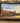 CASTLE ON THE COAST OIL PAINTING IN ORNATE BROWN FRAME