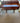 VINTAGE DARK PINE DESK, 3 FRONT DRAWERS, 5 SMALL DRAWERS, WHITE KNOBS