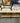 LARGE COFFEE TABLE, LIGHT WOOD TOP, WROUGHT IRON LEGS
