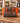 MICHAEL KORS CLARA MEDIUM BROWN AND ORANGE MESSENGER HANDBAG