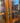 TALL DARK WOOD HUTCH w/ 2 LEADED GLASS DOORS, 1 DRAWER on BOTTOM