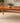 WALTER OF WABASH CHERRY WOOD DINING TABLE WITH 2 LEAVES