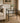 TWO-TIER ACCENT TABLE WITH GLASS SHELVES AND BLACK METAL FRAMING