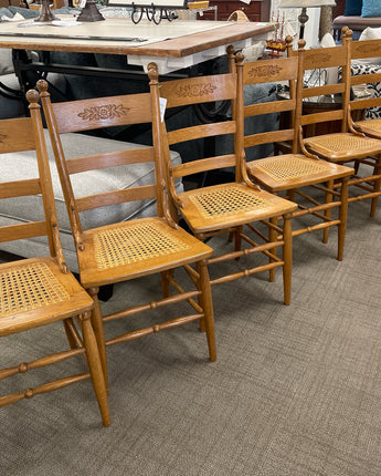 SET OF 6 SOLID OAK CHAIRS WITH CANE SEATS AND FLOWERS ETCHED ON BACK