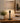 TALL BRONZE METAL COLUMN WITH PIERCED METAL GALLERY, TAUPE CRACKLE GLAZED CERAMI
