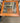 END TABLE, WOOD/GLASS TOP, ORNATE METAL LEGS, WOOD SHELF UNDER