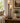 TALL TWO-LIGHT CANDLE STYLE SHADES ON BRONZE STAND TABLE LAMPS